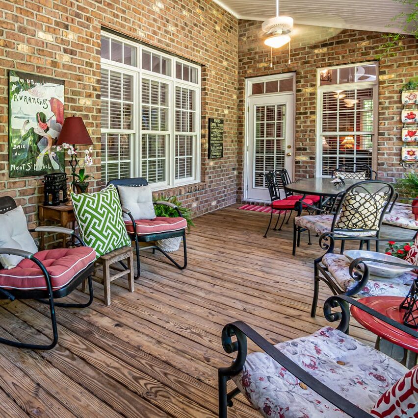 proper patio with table, chair , lighting and artwork