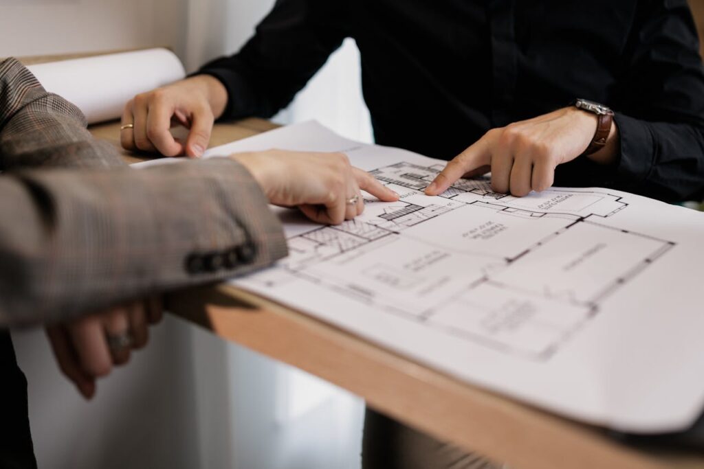 two famous interior designer making plan for a project